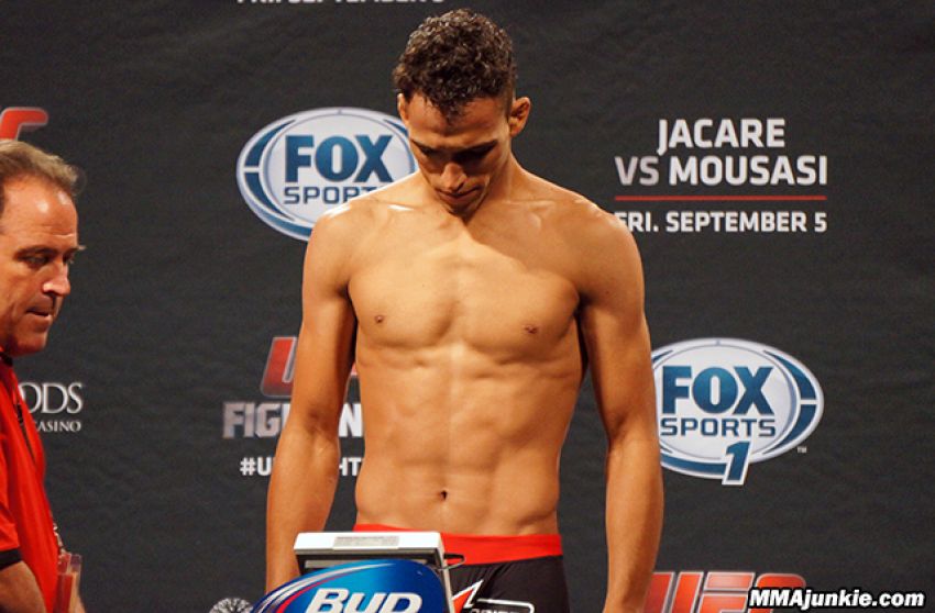 Charles Oliveira is ready to go down to featherweight for what?